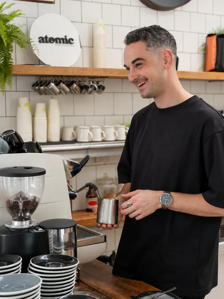 A barista preparing coffee at Little Long Espresso